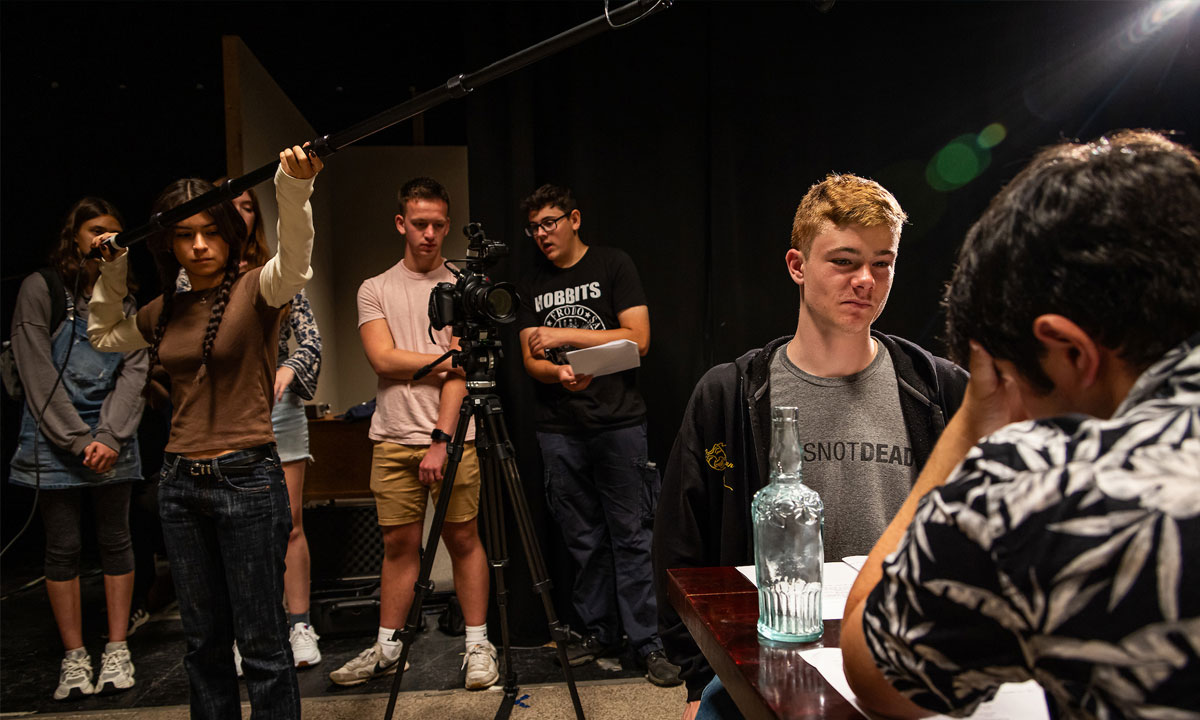 students filming on set