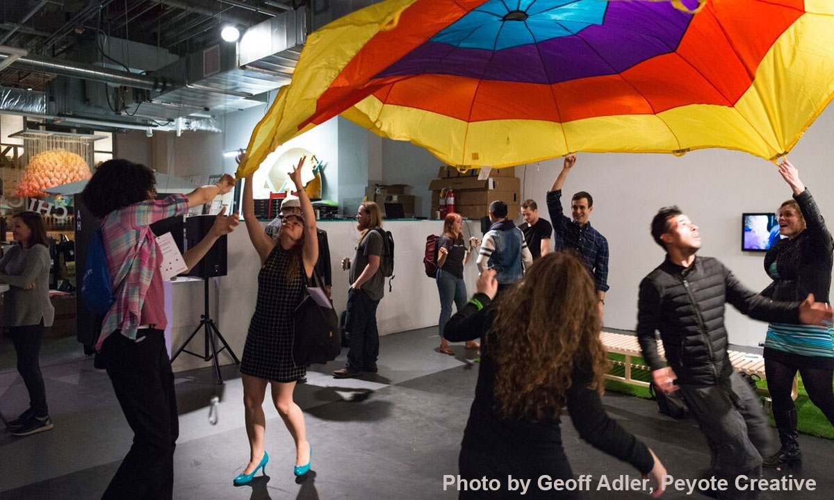 visitors engaging in a fun interaction at an exhibit